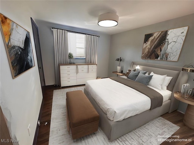 bedroom featuring wood finished floors