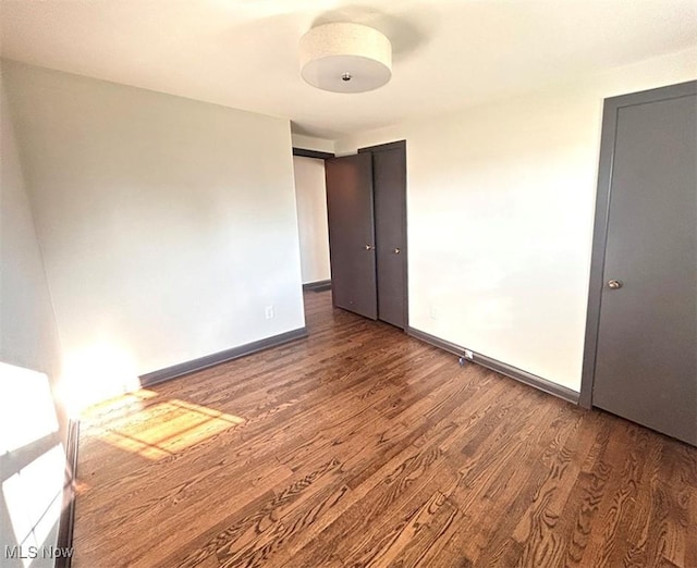 174 N Vine St, Columbiana, OH 44408 - unfurnished room with wood finished floors and baseboards