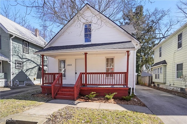 view of front of house featuring a porch and a shingled roof