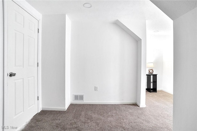 bonus room with visible vents, baseboards, and carpet flooring