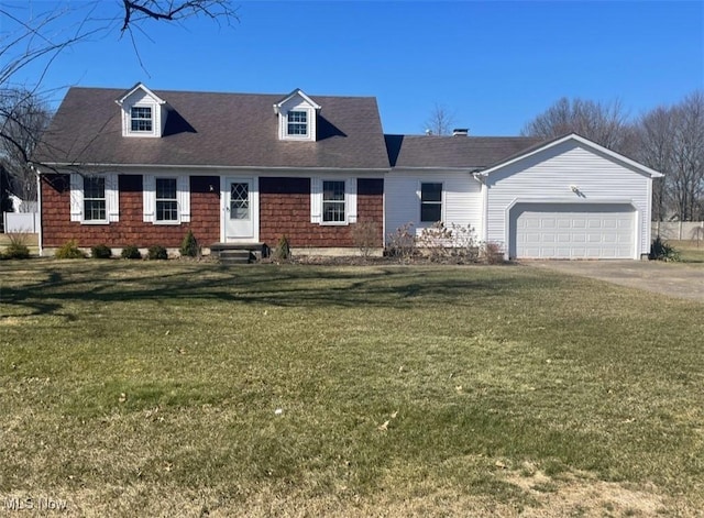 view of front facade featuring a garage, driveway, and a front yard