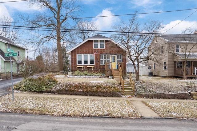 view of front of property featuring brick siding