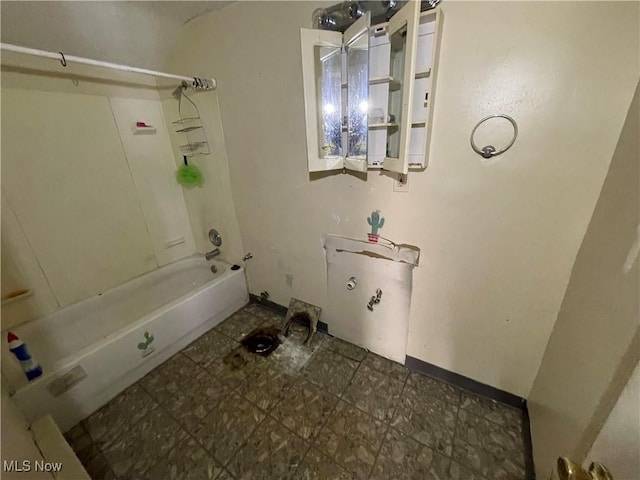 full bath with tile patterned floors, shower / tub combination, and baseboards