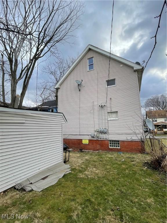 view of property exterior featuring a yard