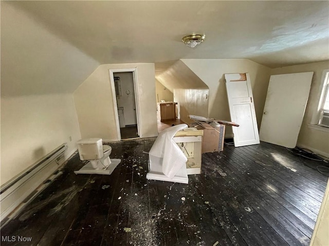 bonus room with vaulted ceiling and hardwood / wood-style flooring