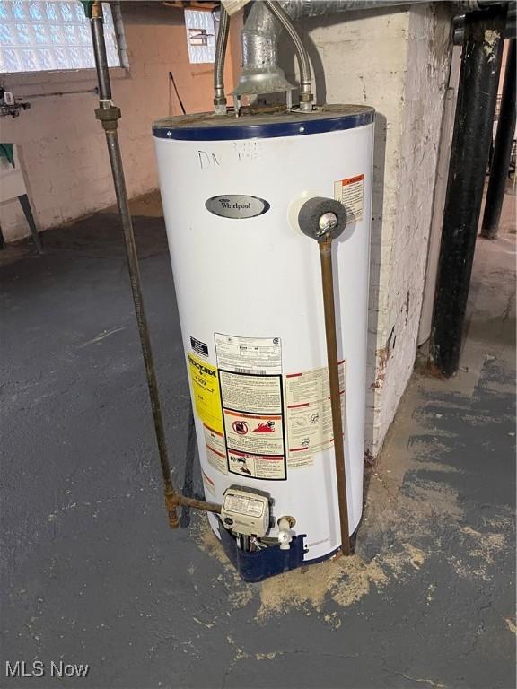 utility room with gas water heater