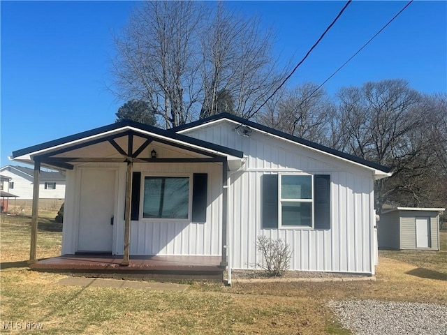 view of front of house with a front yard and board and batten siding