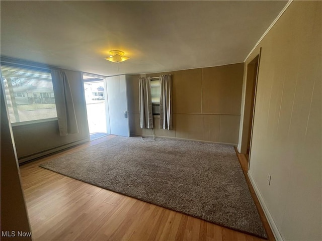 spare room featuring wood finished floors