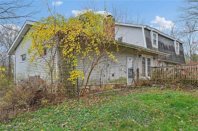 rear view of house with a gambrel roof