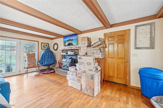 interior space with beam ceiling and hardwood / wood-style flooring