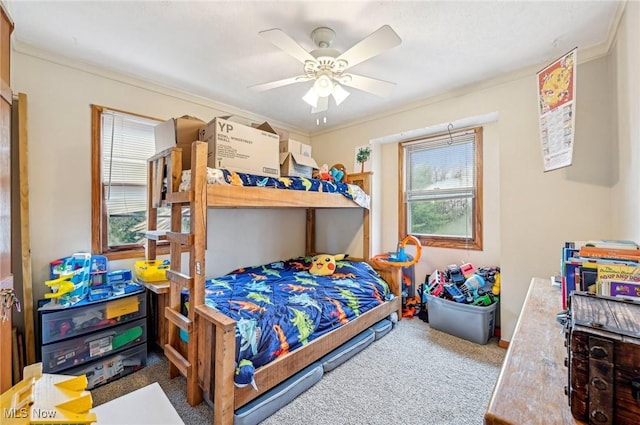 bedroom featuring multiple windows, carpet, and crown molding