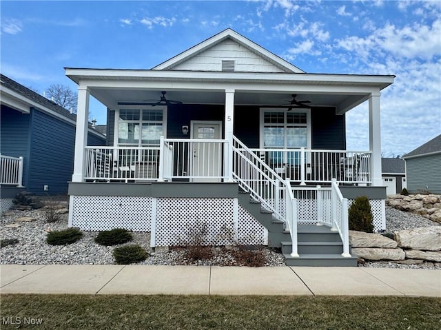 view of front of home with a porch, stairs, and ceiling fan