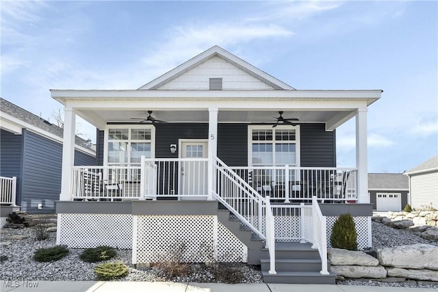 view of front of property with covered porch, ceiling fan, and stairs