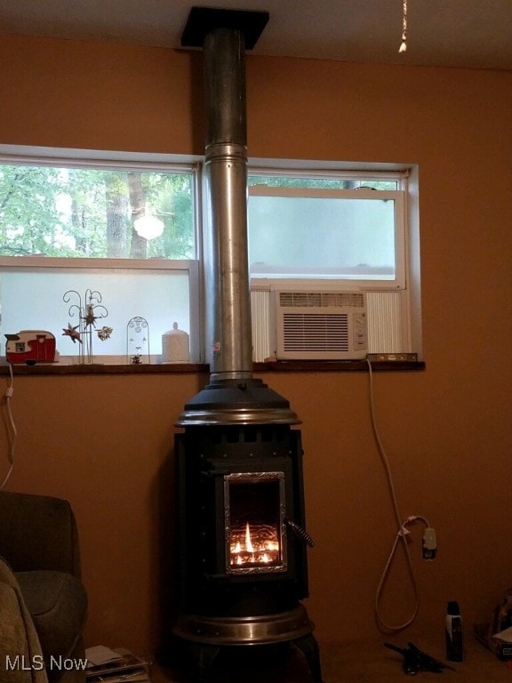 details featuring cooling unit and a wood stove