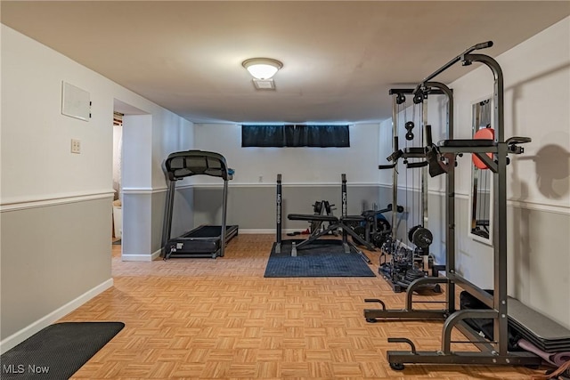 workout area featuring baseboards