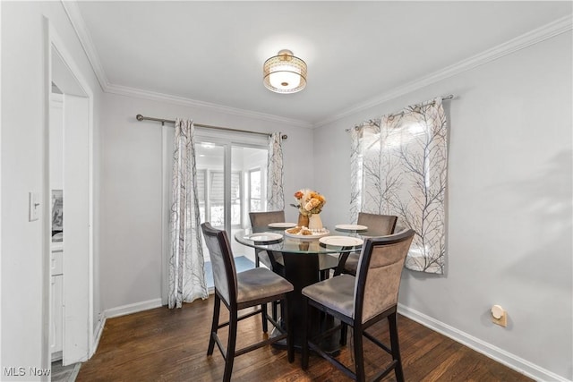 dining space with dark wood finished floors, baseboards, and ornamental molding