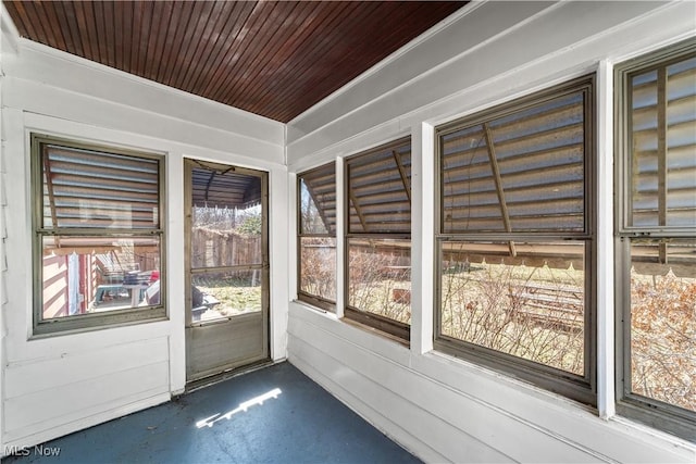 unfurnished sunroom with wooden ceiling