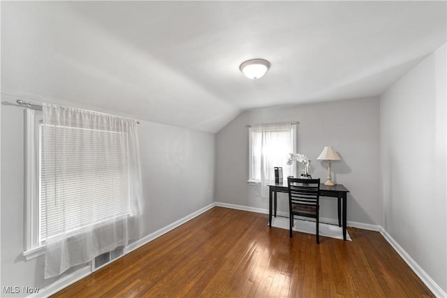 bonus room featuring baseboards, hardwood / wood-style floors, and vaulted ceiling