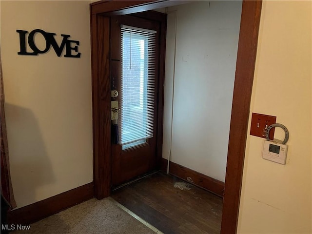 entryway featuring baseboards