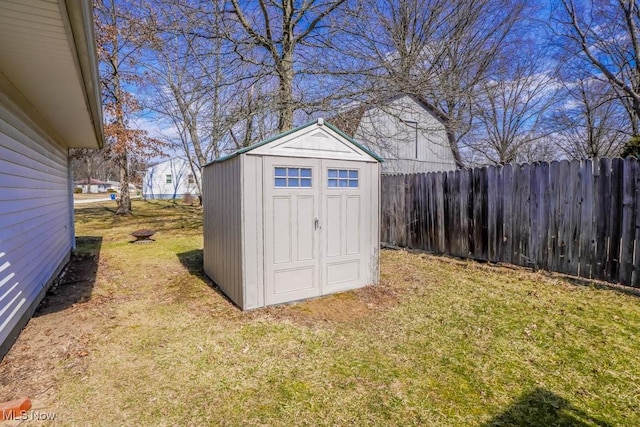 view of shed with fence