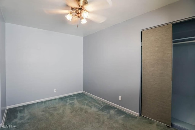 unfurnished bedroom featuring baseboards, carpet floors, a closet, and a ceiling fan