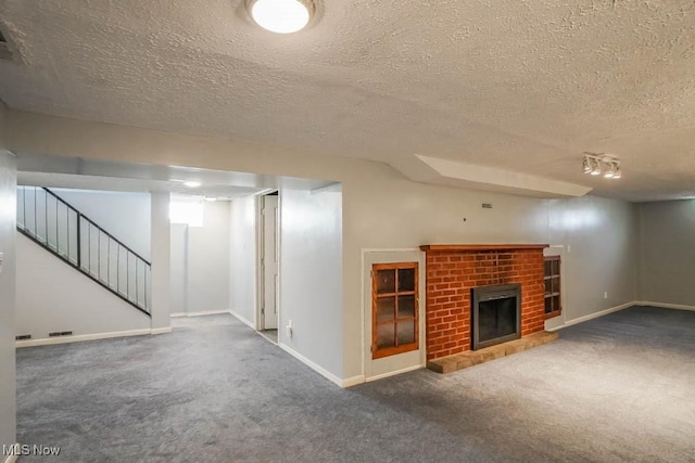 basement with carpet flooring, stairway, baseboards, and a brick fireplace