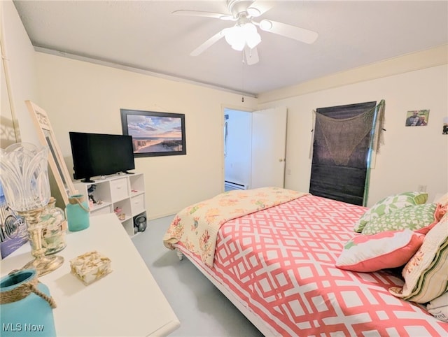 bedroom featuring baseboard heating and ceiling fan