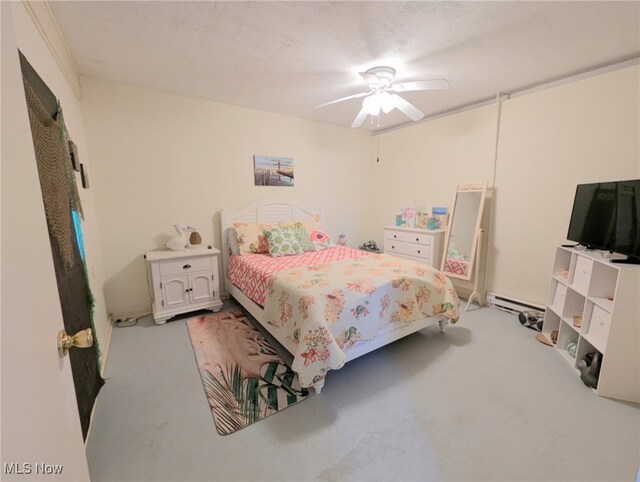 bedroom with baseboard heating, a ceiling fan, and a textured ceiling