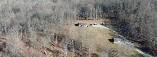 birds eye view of property with a wooded view