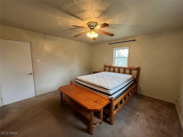 carpeted bedroom with baseboards, a textured ceiling, and a ceiling fan