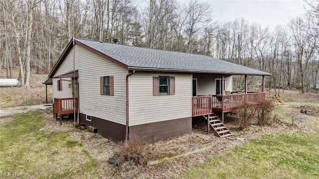 view of front of property with roof with shingles