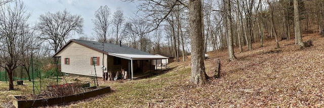 view of home's exterior featuring a garden