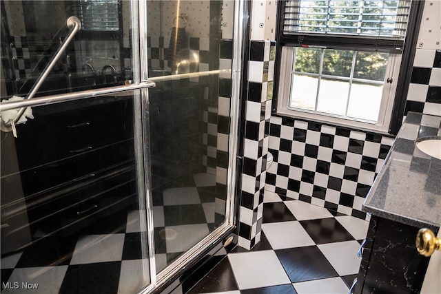 full bath featuring a stall shower and vanity