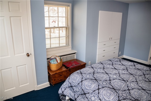 bedroom featuring baseboards