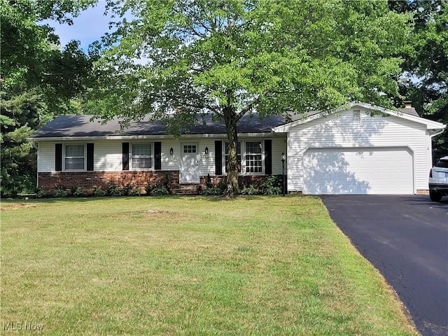 single story home with brick siding, aphalt driveway, a garage, and a front yard