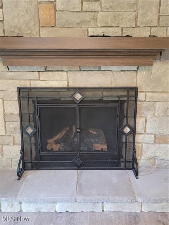 room details featuring a stone fireplace