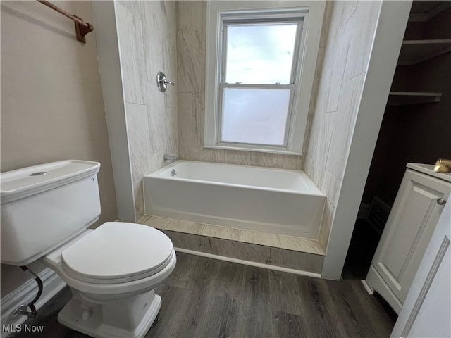 bathroom with toilet and wood finished floors