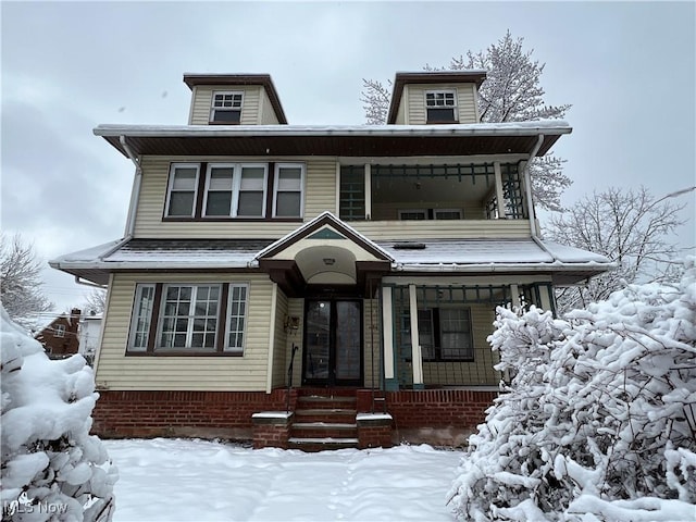 traditional style home featuring covered porch