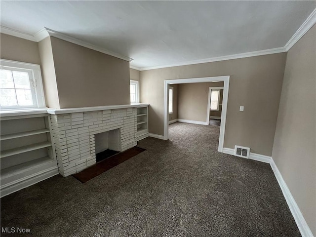 unfurnished living room with carpet flooring, a fireplace, visible vents, and baseboards