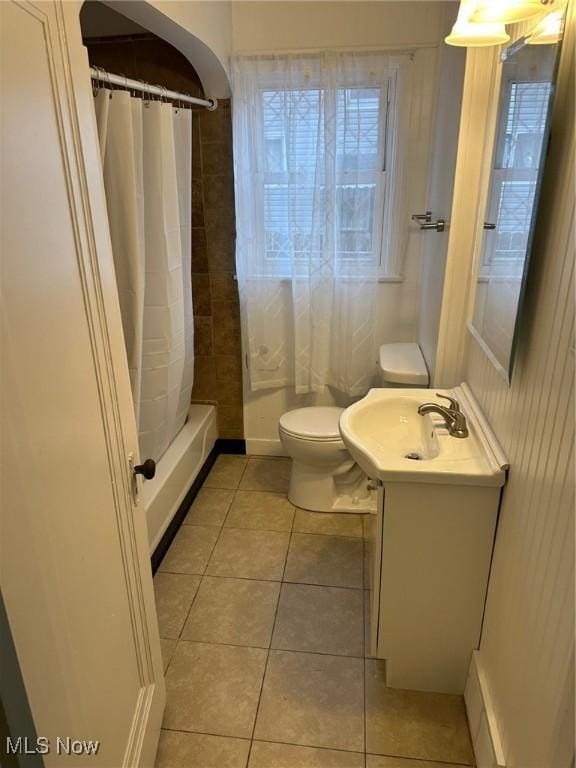 full bathroom with tile patterned flooring, toilet, vanity, and a shower with curtain