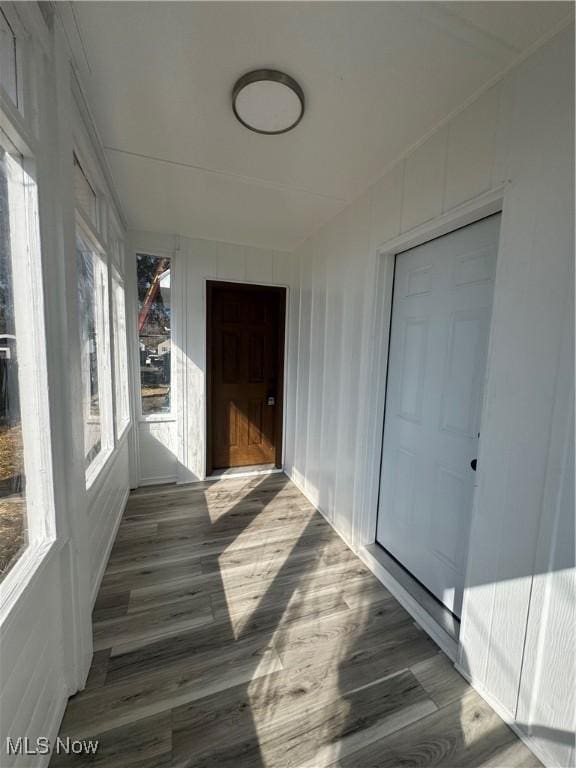 corridor featuring wood finished floors