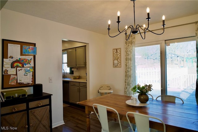 dining area featuring an inviting chandelier and dark wood-style flooring