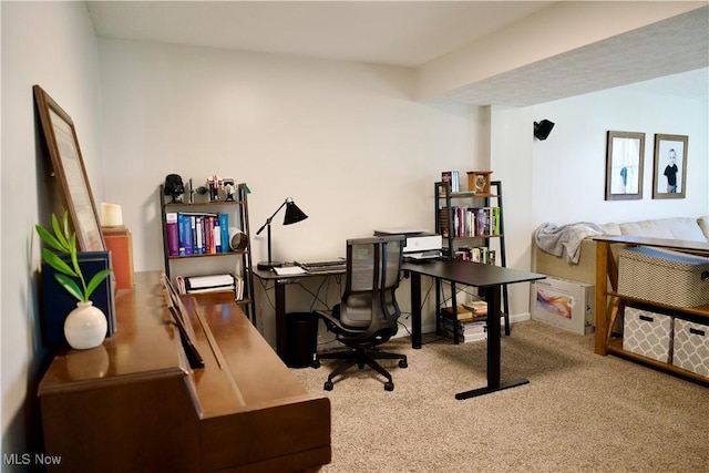 home office featuring baseboards and carpet flooring