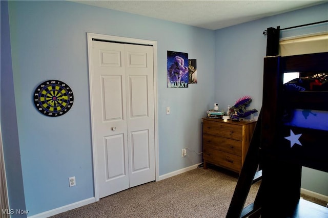 carpeted bedroom with baseboards