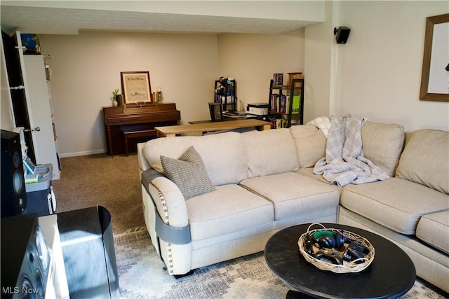 carpeted living area with baseboards