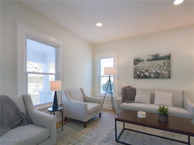 living room with recessed lighting and light wood-style floors