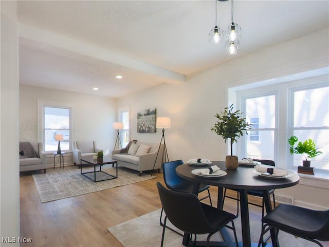 dining room featuring beam ceiling, recessed lighting, light wood-type flooring, and baseboards