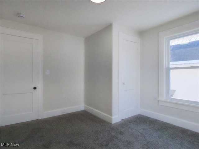 bonus room with baseboards and carpet floors