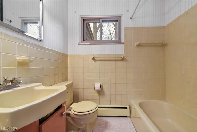 bathroom featuring baseboard heating, toilet, wallpapered walls, and a healthy amount of sunlight