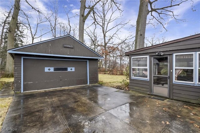 detached garage featuring driveway